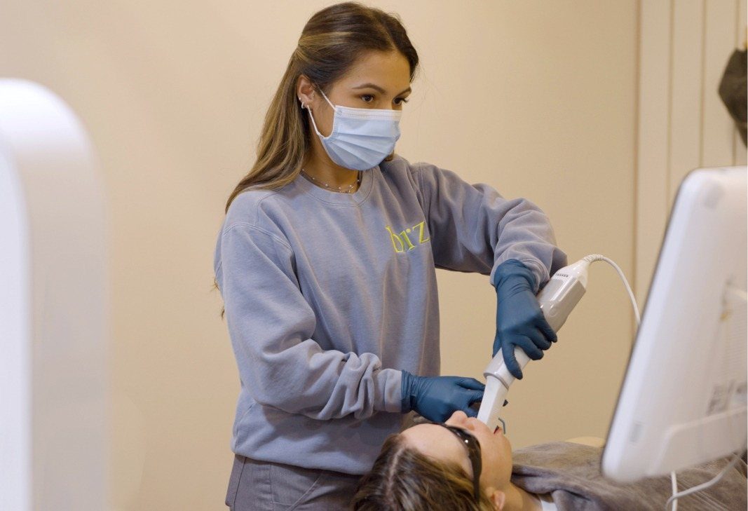 Hygienist taking images of client