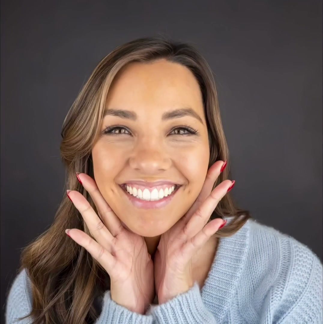 Patient smiling after treatment at Breeze Dental
