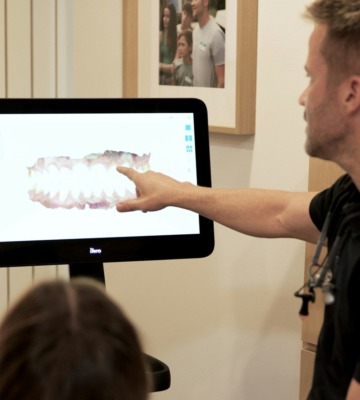 Breeze Dental dentist looking at xrays